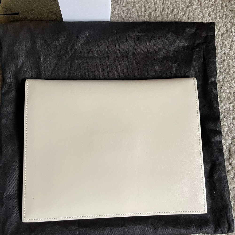 •Magnetic flap closure
•Gold-tone logo hardware at front
•Fabric lining - Picture 3 of 6